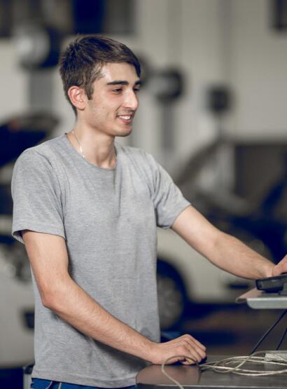 Young mechanic working on diagnostics